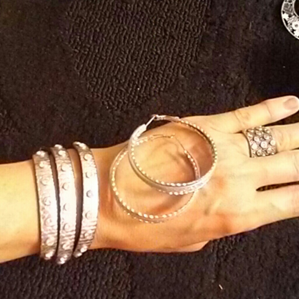 One pair of silver hoop earrings one silver wrap a